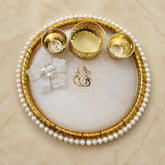 8 inch white marble resin pooja thali with pearl border and gold ganesh design with diya holders decorative aarti plate for home temple use