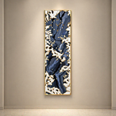 Abstract painting with blue and white patterns on a beige wall