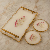Decorative tray with floral design on a marble surface