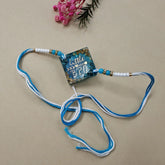 Necklace with a decorative pendant on a beige background