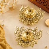 Decorative gold lamps with intricate designs on a light background