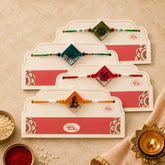 Premium designer handmade resin rakhi set for brothers with glossy finish, decorative beads, and festive Raksha Bandhan styling