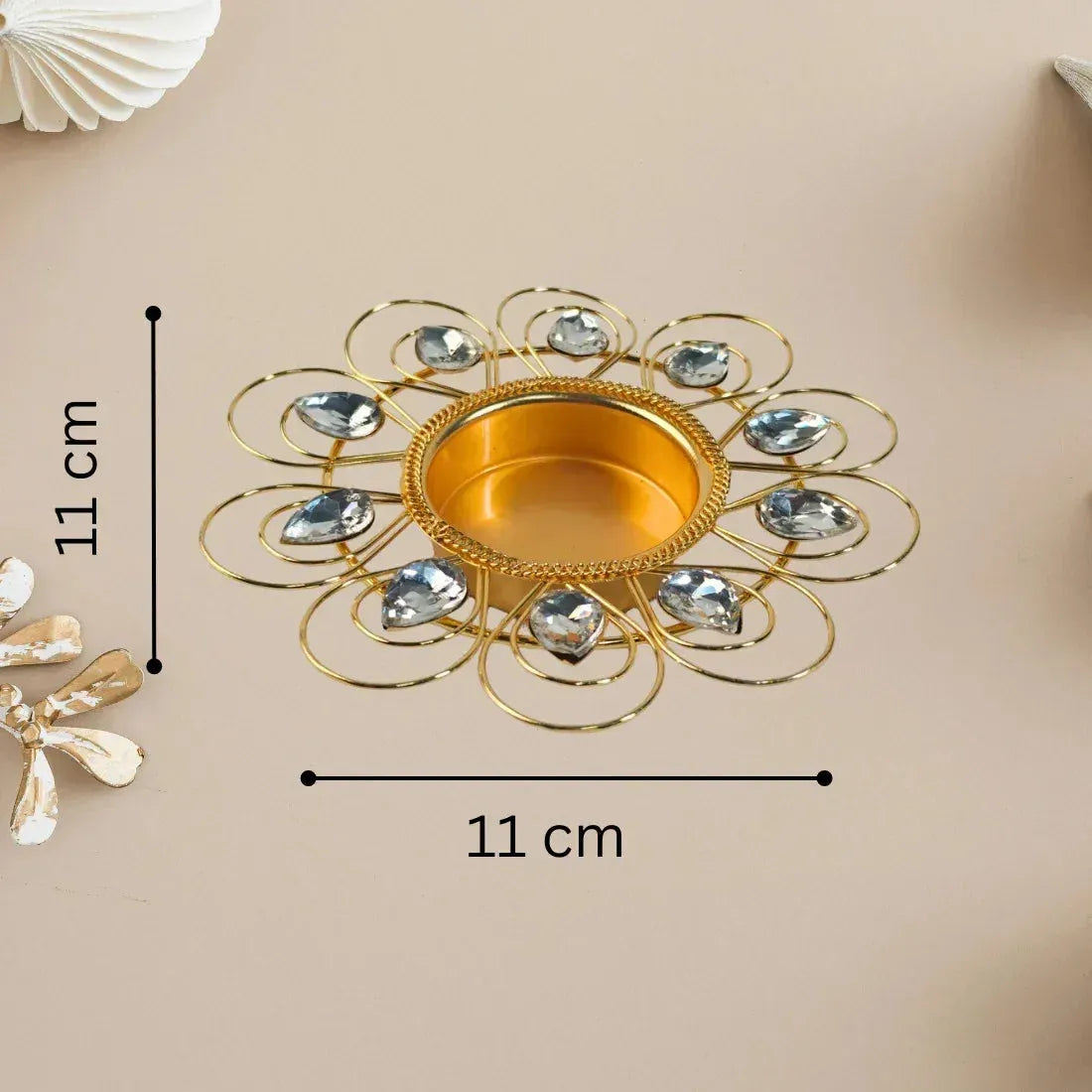 Decorative gold and silver bowl with measurements on a beige background
