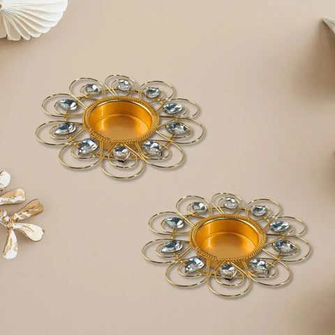 Two decorative metal trays with gold and silver design on a beige background