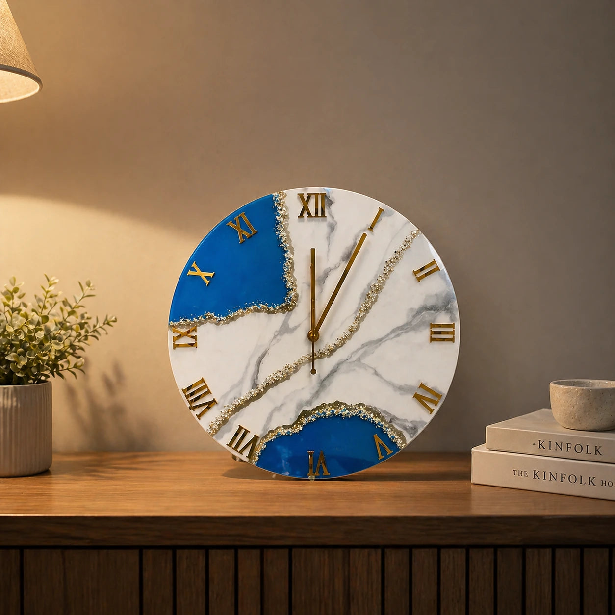 Decorative clock with blue and white design on a wooden surface