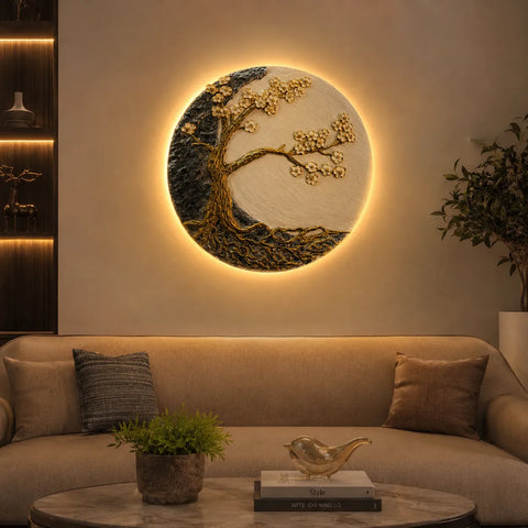 Decorative wall art with a tree design illuminated by lights in a living room setting.