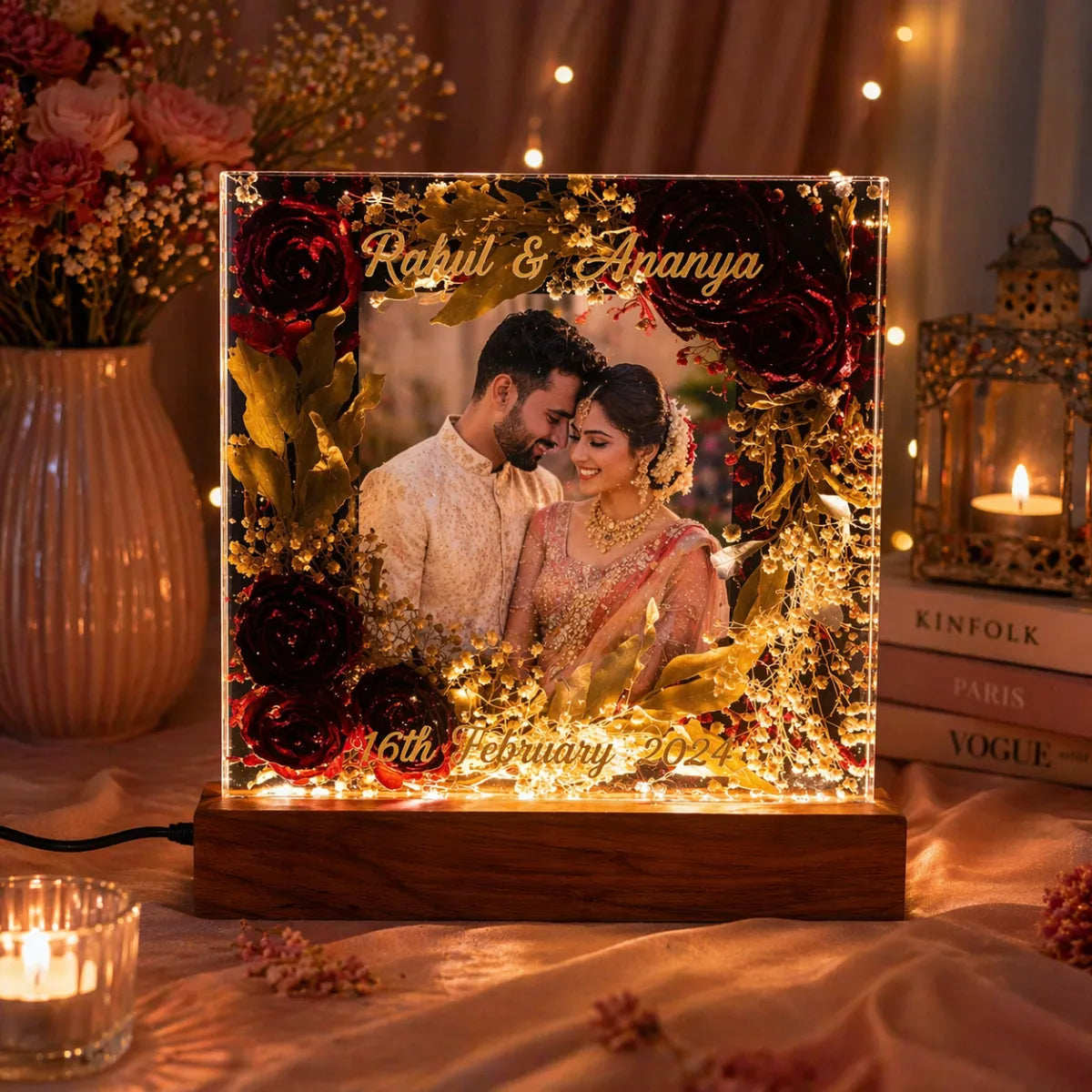 Decorative light box with a couple's photo, flowers, and personalized text on a romantic setting.