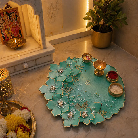 8 inch mint green floral resin pooja thali placed in pooja room setup with diya, kumkum, chawal and flowers decorative aarti plate in home temple use