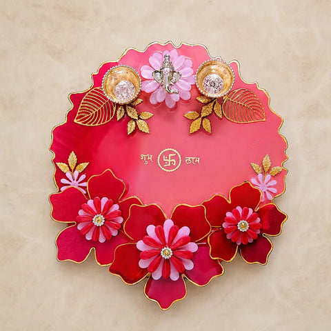 8 inch resin pooja thali in pink red with gold accents and ganesha design decorative festive plate