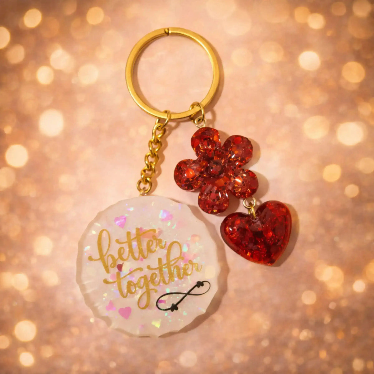 Keychain with 'better together' charm on a glittery background