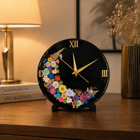 Decorative clock with colorful flowers on a wooden surface