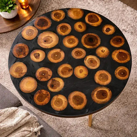 Round wooden table with circular wood slices on a carpeted floor