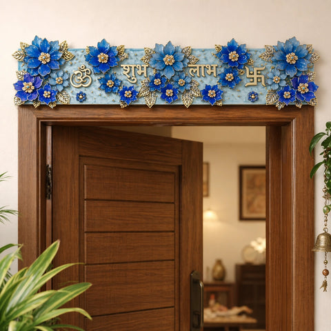 Decorative floral arch over a wooden door with blue flowers and gold accents.