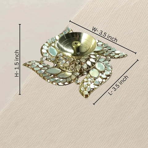 Decorative Diwali lamp with measurements on a beige background