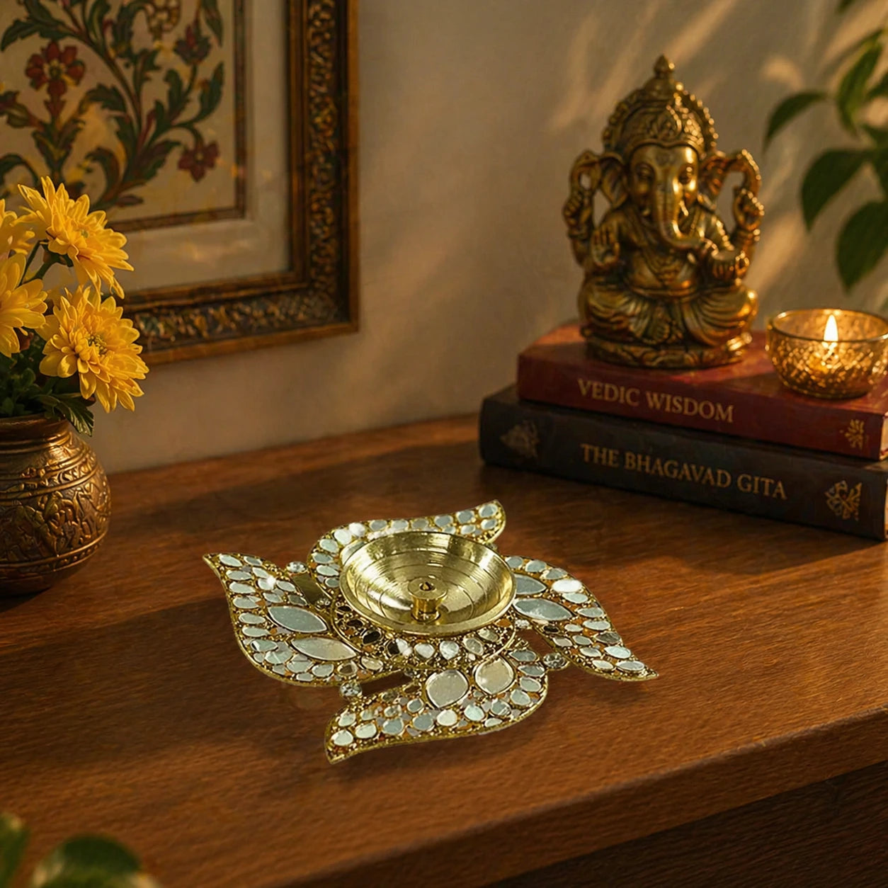 Decorative brass lamp on a wooden surface with books and a statue in the background