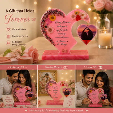 Heart-shaped decorative piece with floral elements and a couple's photo, surrounded by romantic settings.