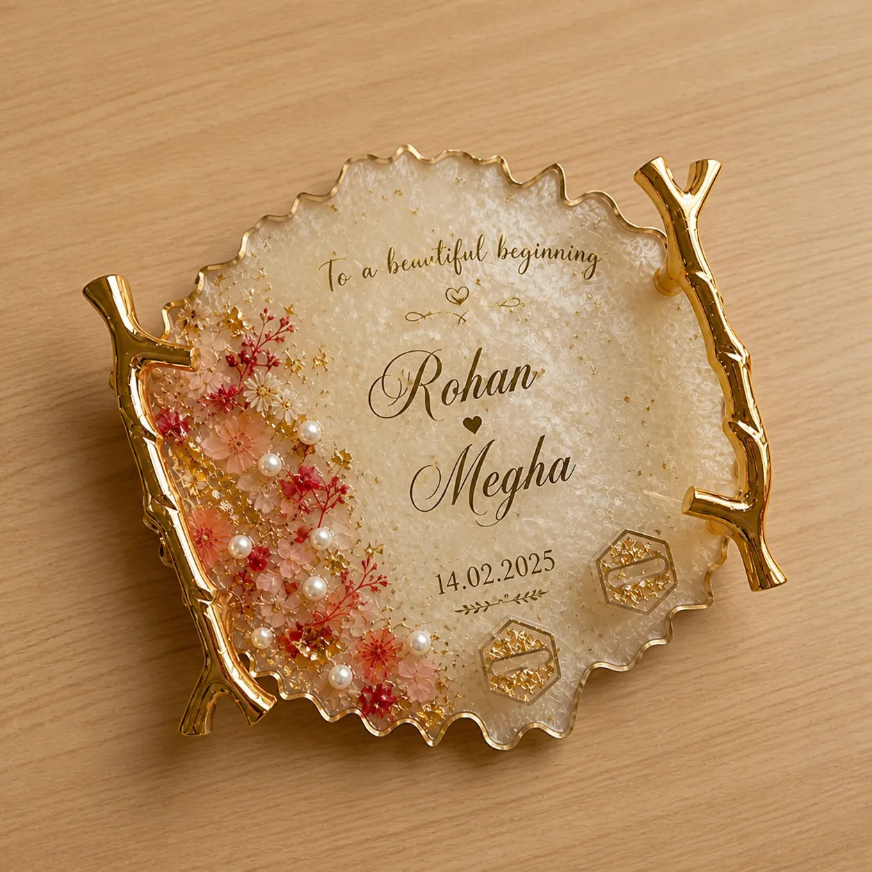 Decorative plate with floral design and personalized text on a wooden surface