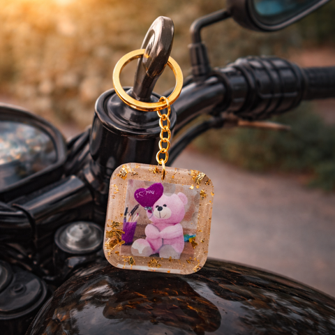 Keychain with a teddy bear and heart on a motorcycle handlebar