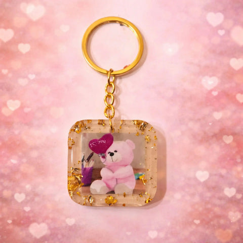Square resin teddy bear keychain with pink bear, heart detail and gold flakes, cute handmade gift for girls and couples