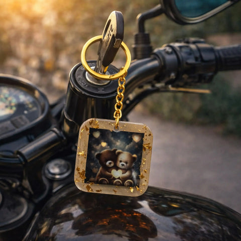 Keychain with teddy bear design on a motorcycle handlebar