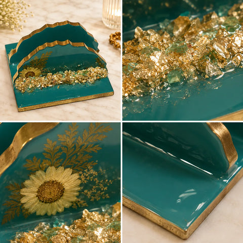 Teal decorative tray with gold accents and floral design on a light background