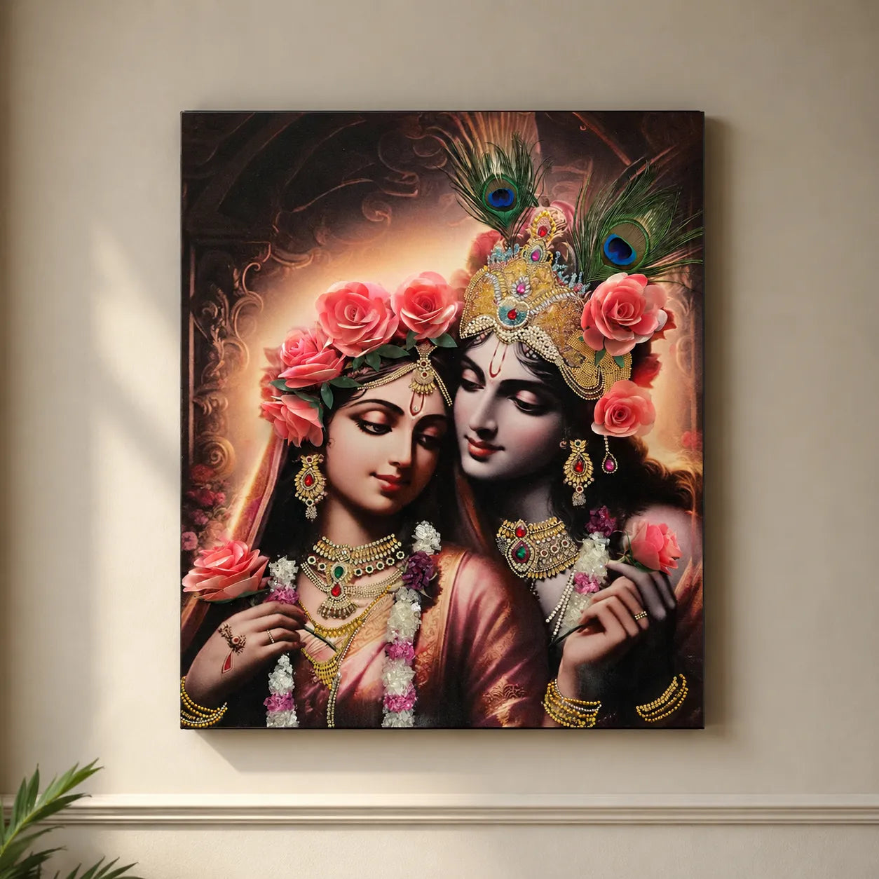 Framed artwork of two figures adorned with jewelry and flowers on a beige wall.