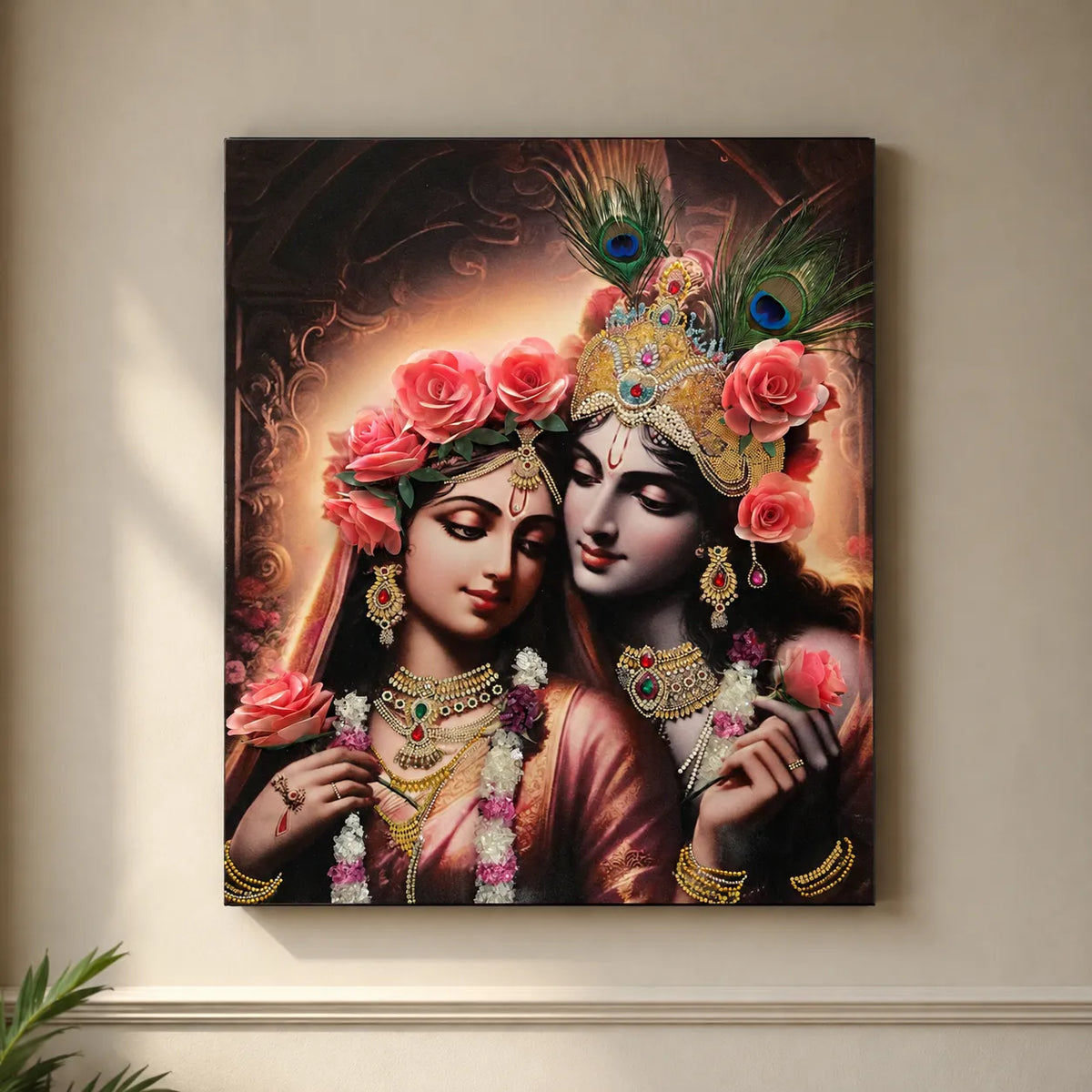 Framed artwork of two figures adorned with jewelry and flowers on a beige wall.