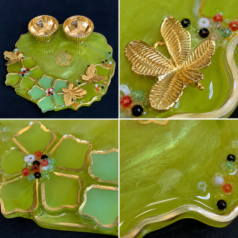 Collage of a decorative green plate with gold butterfly designs and colorful stones.