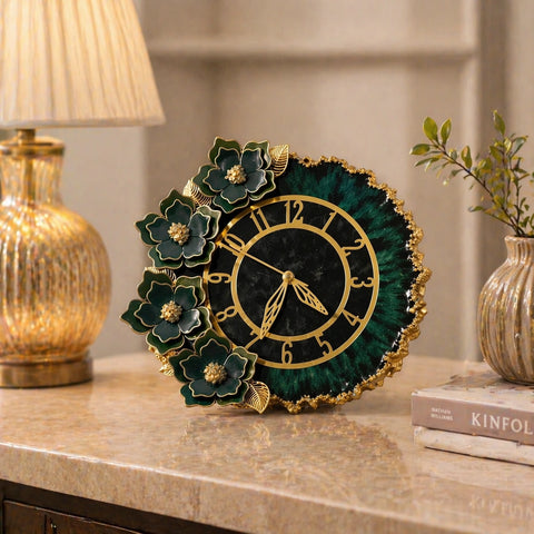 Decorative clock with floral design on a table next to a lamp and books.