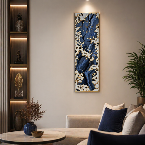 Living room with a large abstract painting on the wall, a couch with pillows, and a side table with decorative items.