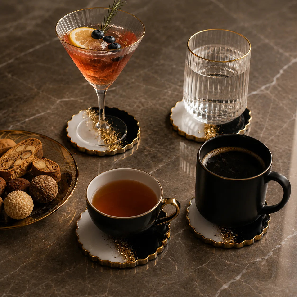 Cocktail, tea, coffee, and cookies on a marble surface