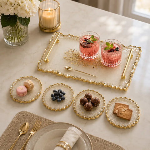 Elegant cream white resin serving tray and coaster set with textured gold edges and gold handles, styled with mocktails, desserts, berries, and luxury dining décor on a premium marble tabletop background.