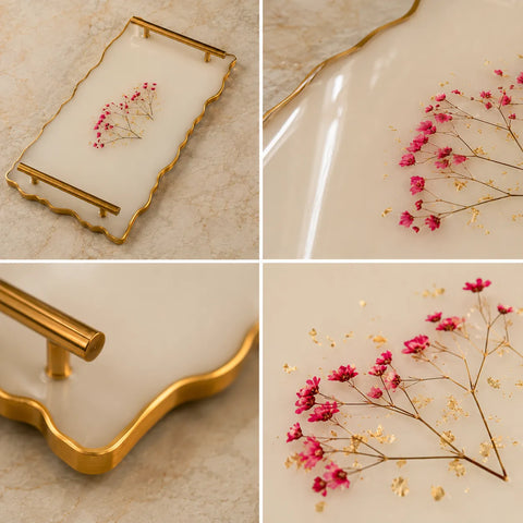Decorative tray with gold rim and pink flowers on a beige background