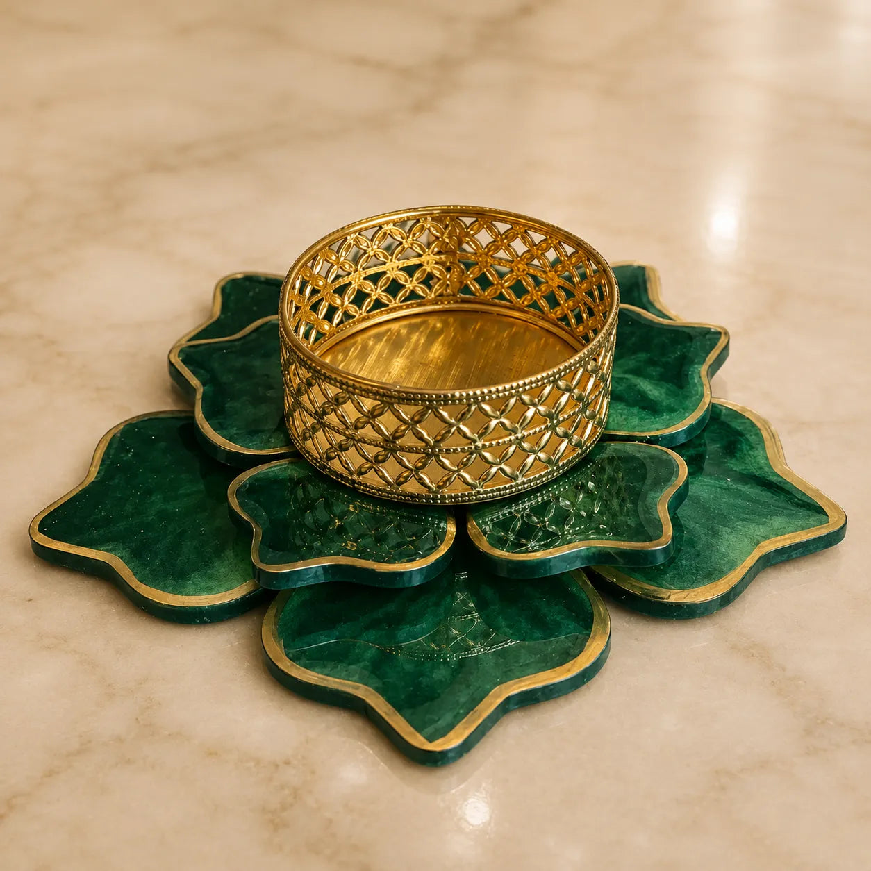 Decorative gold bangle on a green lotus-shaped stand against a beige marble background