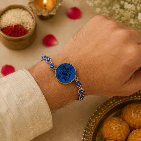 Hand wearing a blue bracelet with gold accents on a festive background