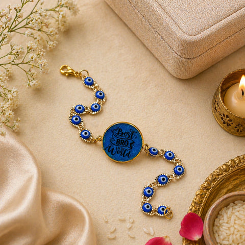 Bracelet with blue evil eye design and gold accents on a beige fabric background