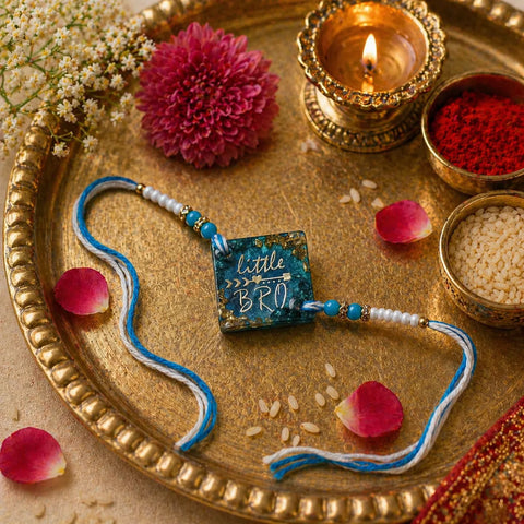 Little Bro handmade resin rakhi placed on pooja thali with diya, roli and rice for Raksha Bandhan ritual