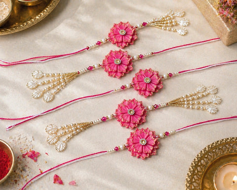 Decorative pink flower-themed bangles on a light background