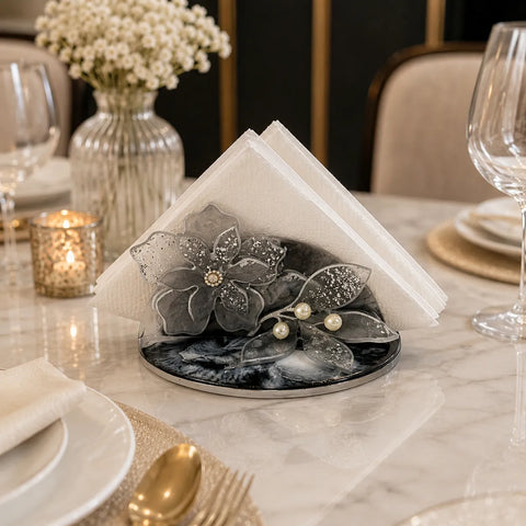 Decorative napkin with floral design on a marble table setting