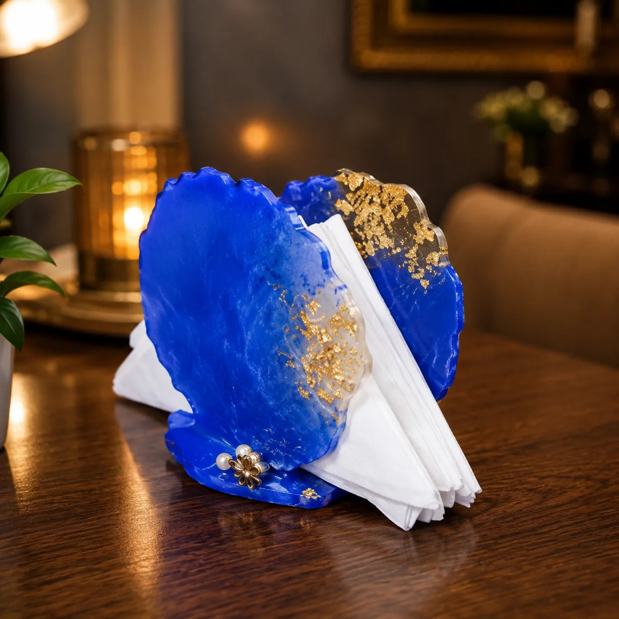 Blue decorative object with gold accents on a wooden table