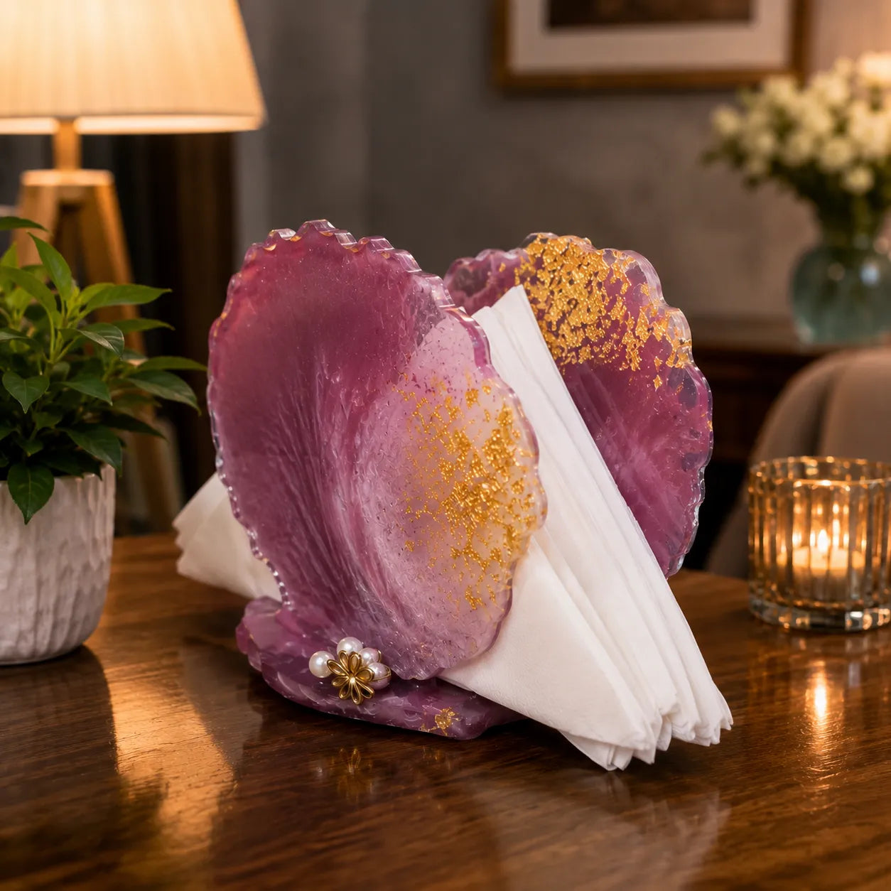 Decorative purple rock with white flowers on a wooden table