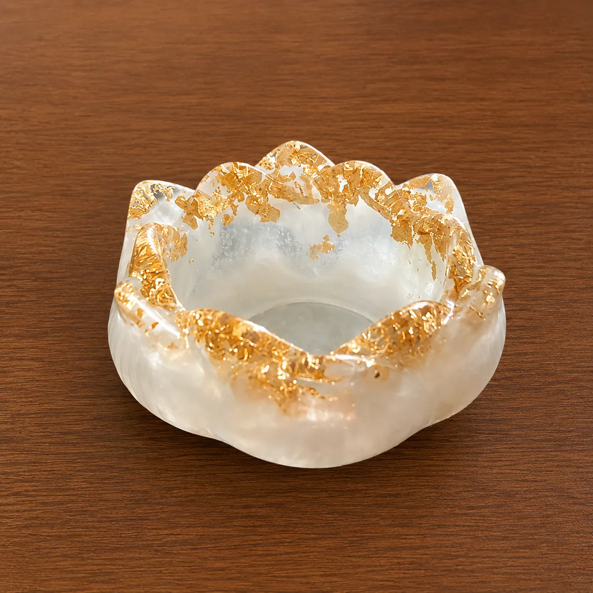 Decorative White & Gold Resin Diya Holder on a wooden surface