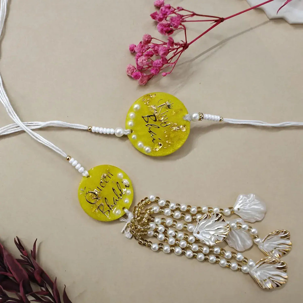 handmade yellow resin bhai bhabhi rakhi set with pearl lumba tassel and bead detailing for raksha bandhan