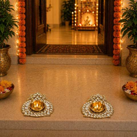 Decorative entrance with gold lamps and floral arrangements on a beige floor.