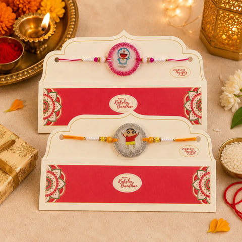 Two Rakhi (handmade ribbons) in decorative envelopes on a festive background with lights and flowers.