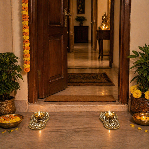 Decorative entrance with flowers, candles, and a wooden door.