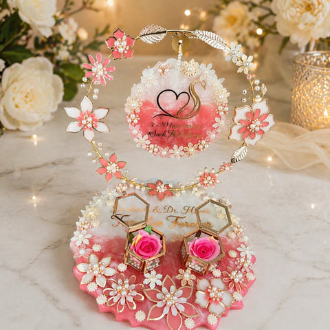 Decorative jewelry set with floral designs on a marble surface