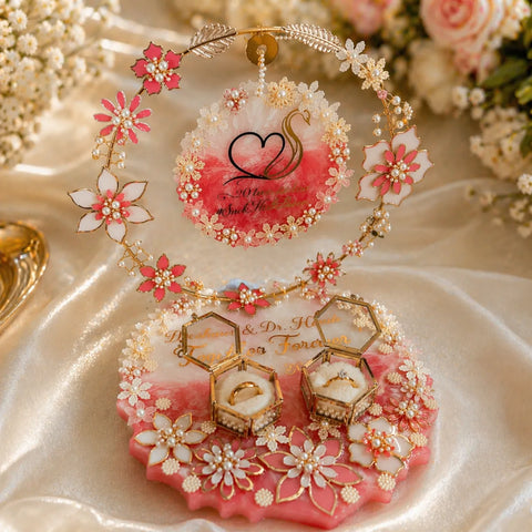Decorative ring holder with floral elements on a soft fabric background