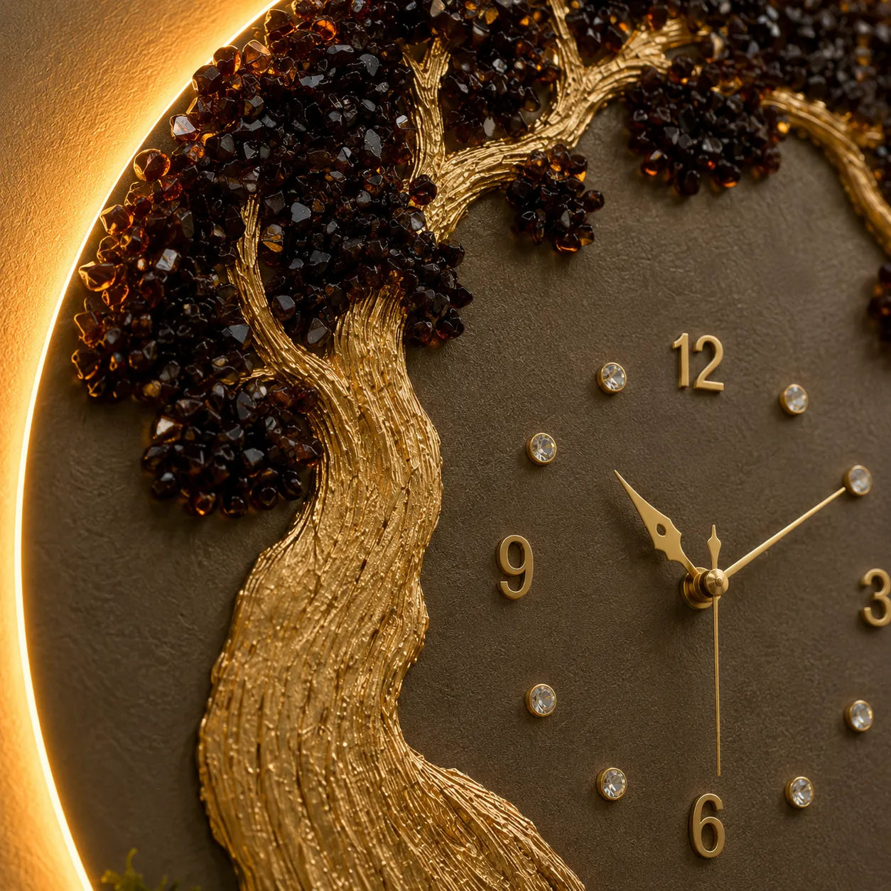 Decorative clock with gold tree design and gemstone accents on a brown background