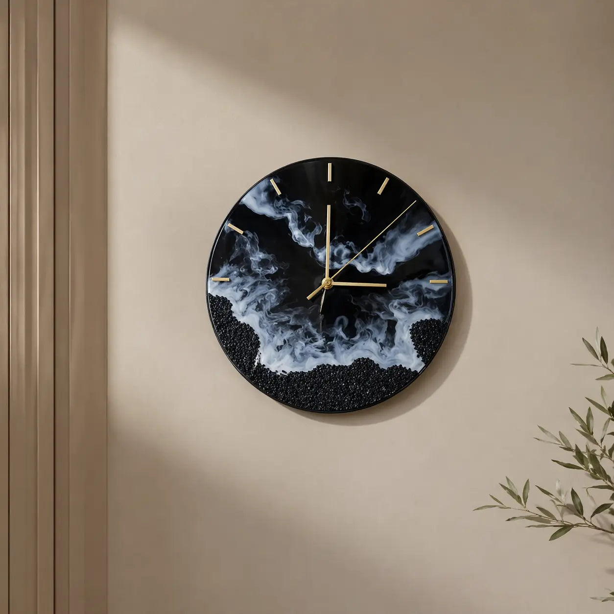 Decorative wall clock with black and blue abstract design on a beige wall.